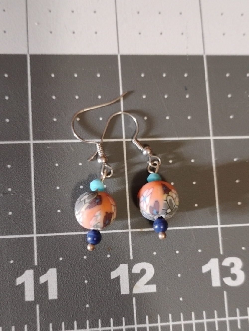 Handmade Orange Floral Bead Drop Earrings with Turquoise and Navy Accents